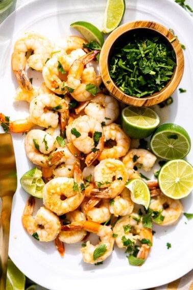 Plate filled with pan cooked cilantro lime shrimp.