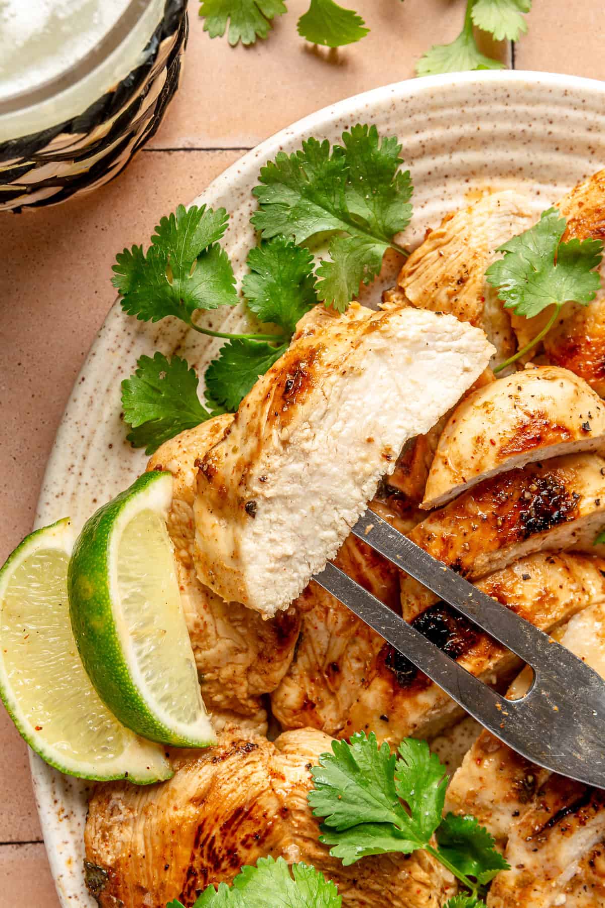 Slice of Chile lime chicken on a fork. 