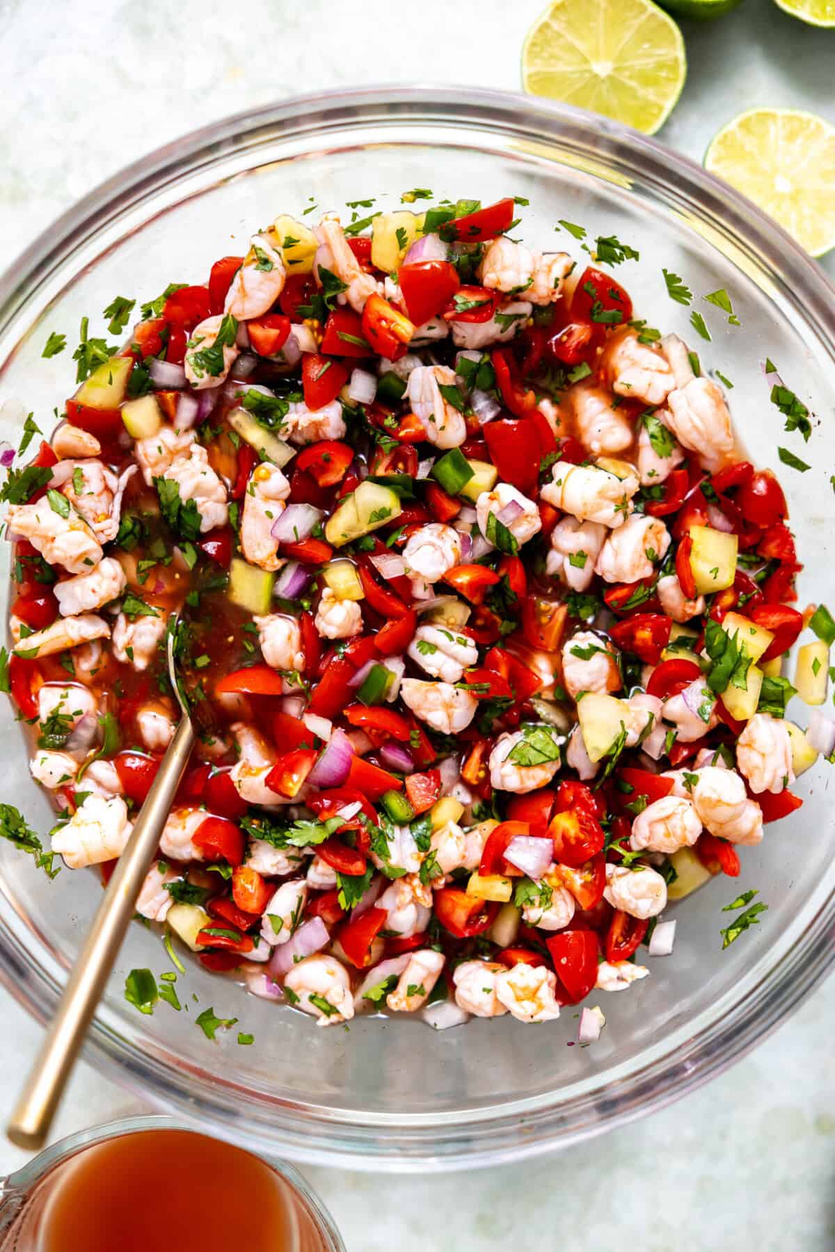 Bowl of shrimp ceviche with a spoon to serve.