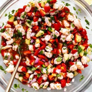 Bowl of shrimp ceviche with a spoon to serve.