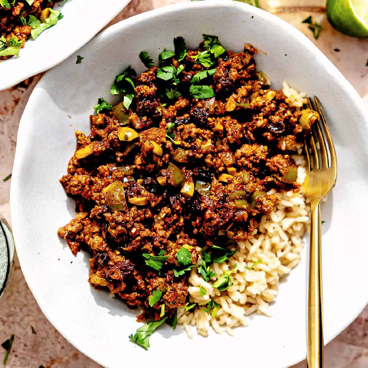 Bowl of Cuban picadillo served over rice. 