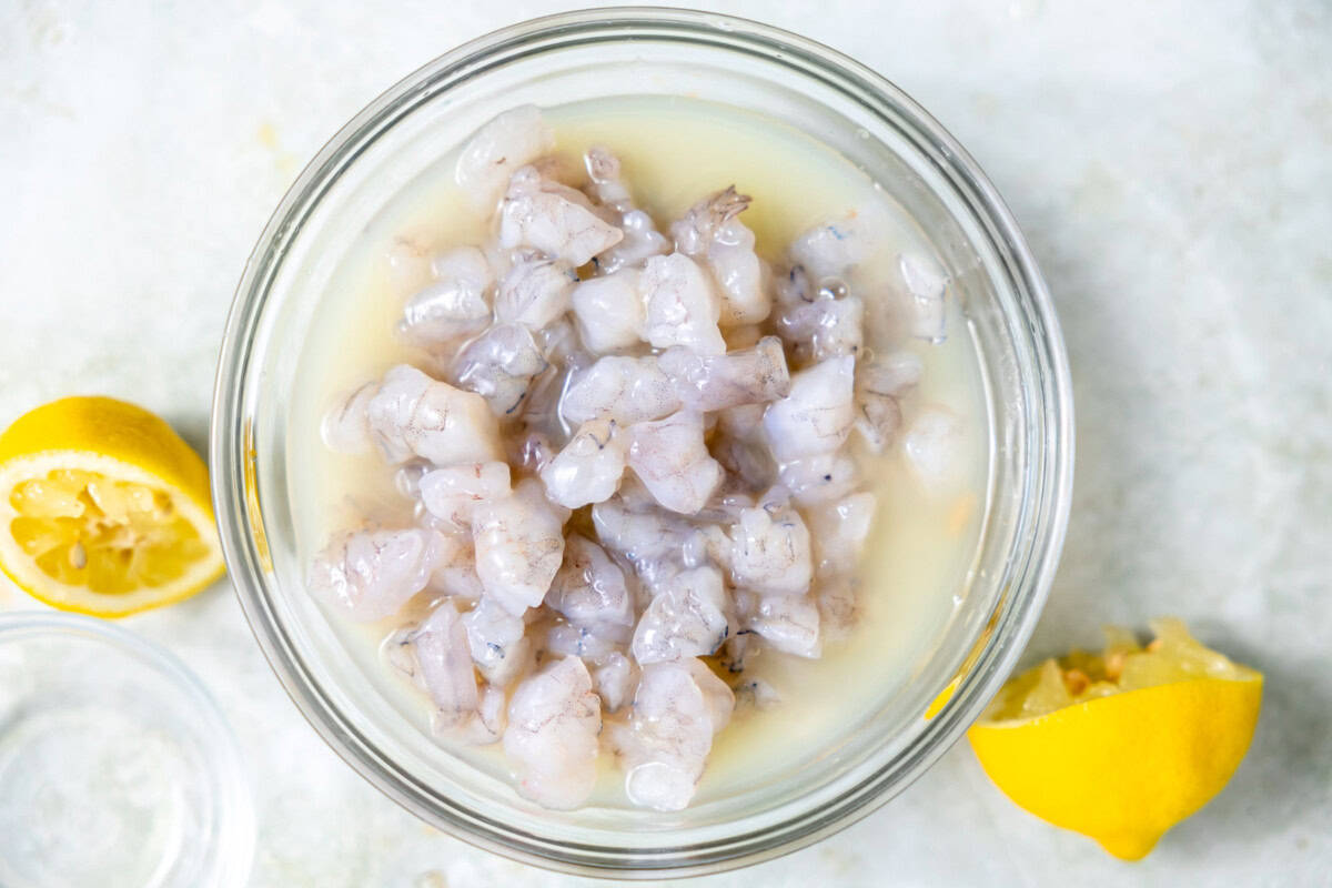 Shrimp soaking in lemon juice.