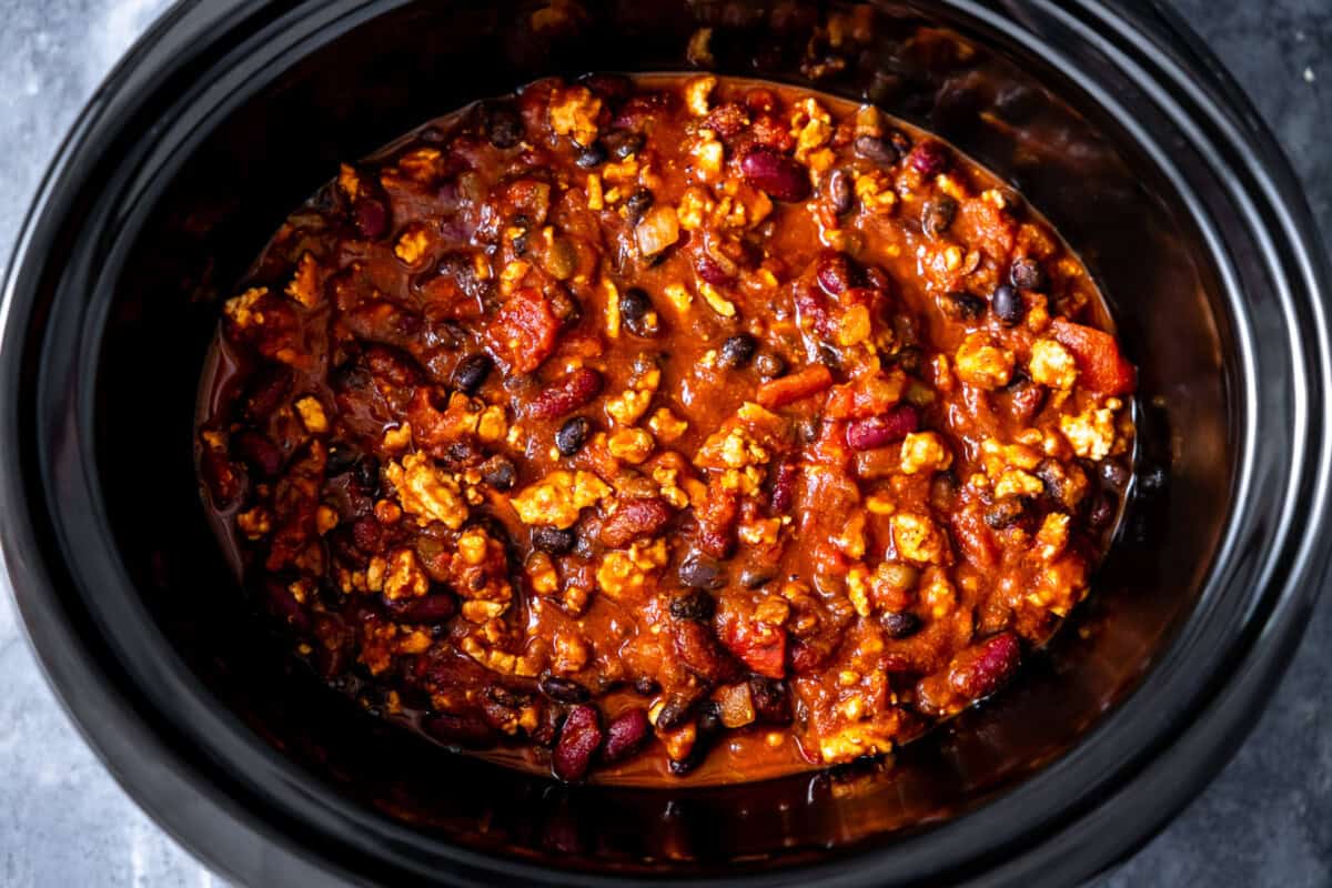 Cooked turkey chili in a slow cooker. 