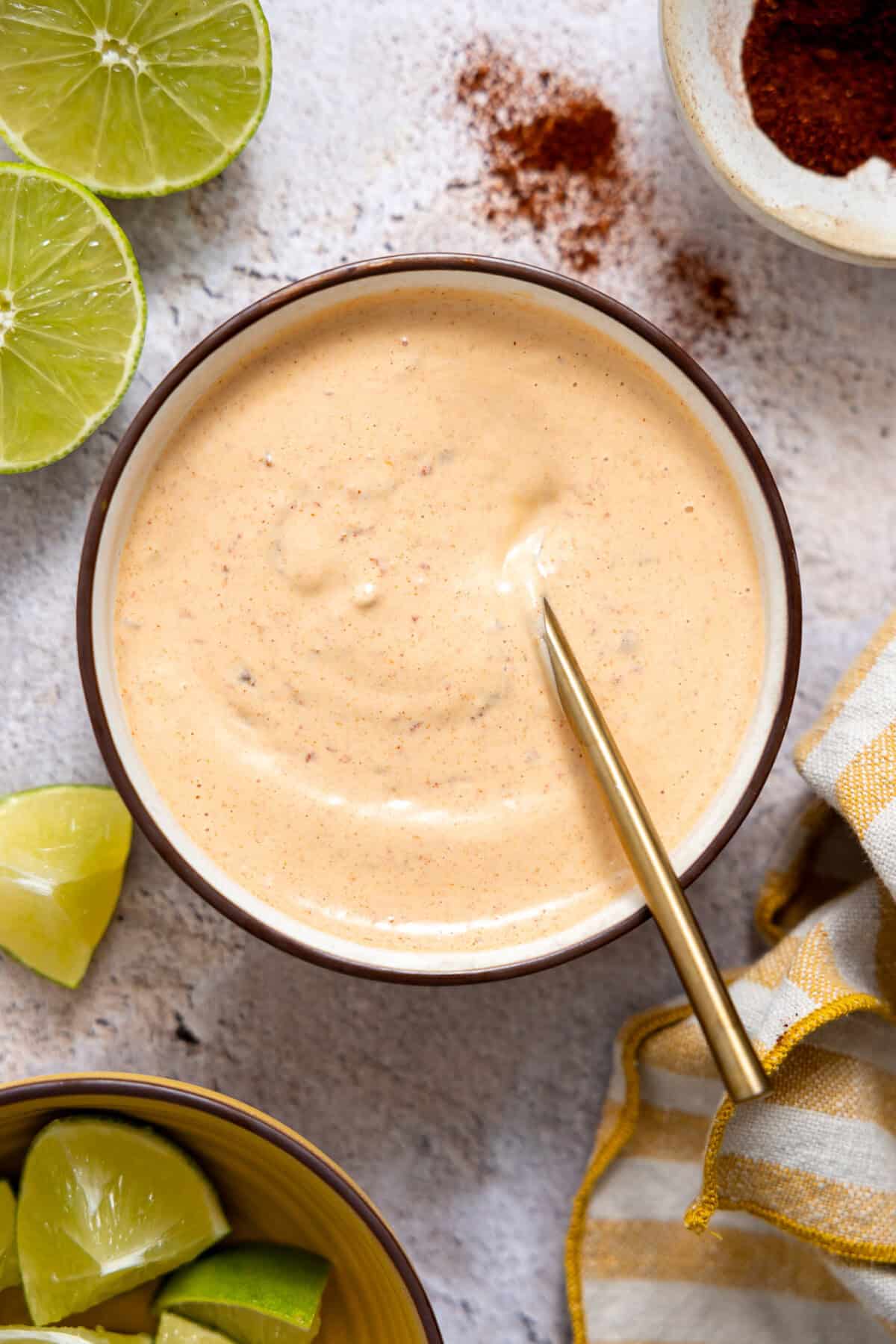 Chipotle Mayo in a bowl with a spoon.