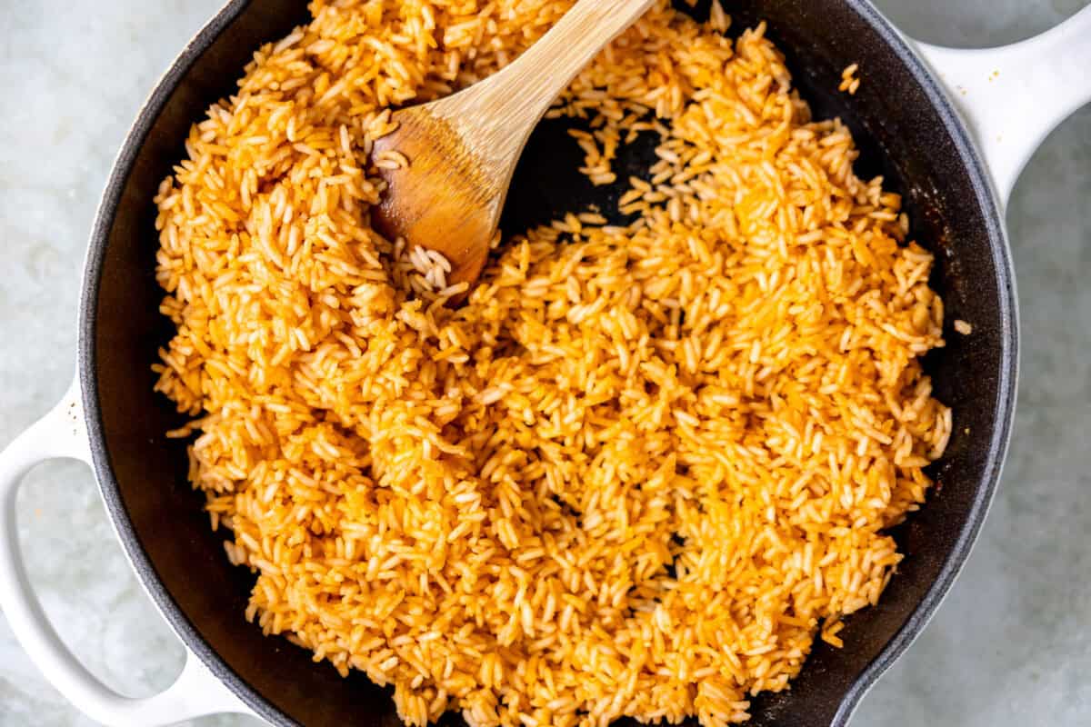 Cooked Mexican rice in a skillet. 