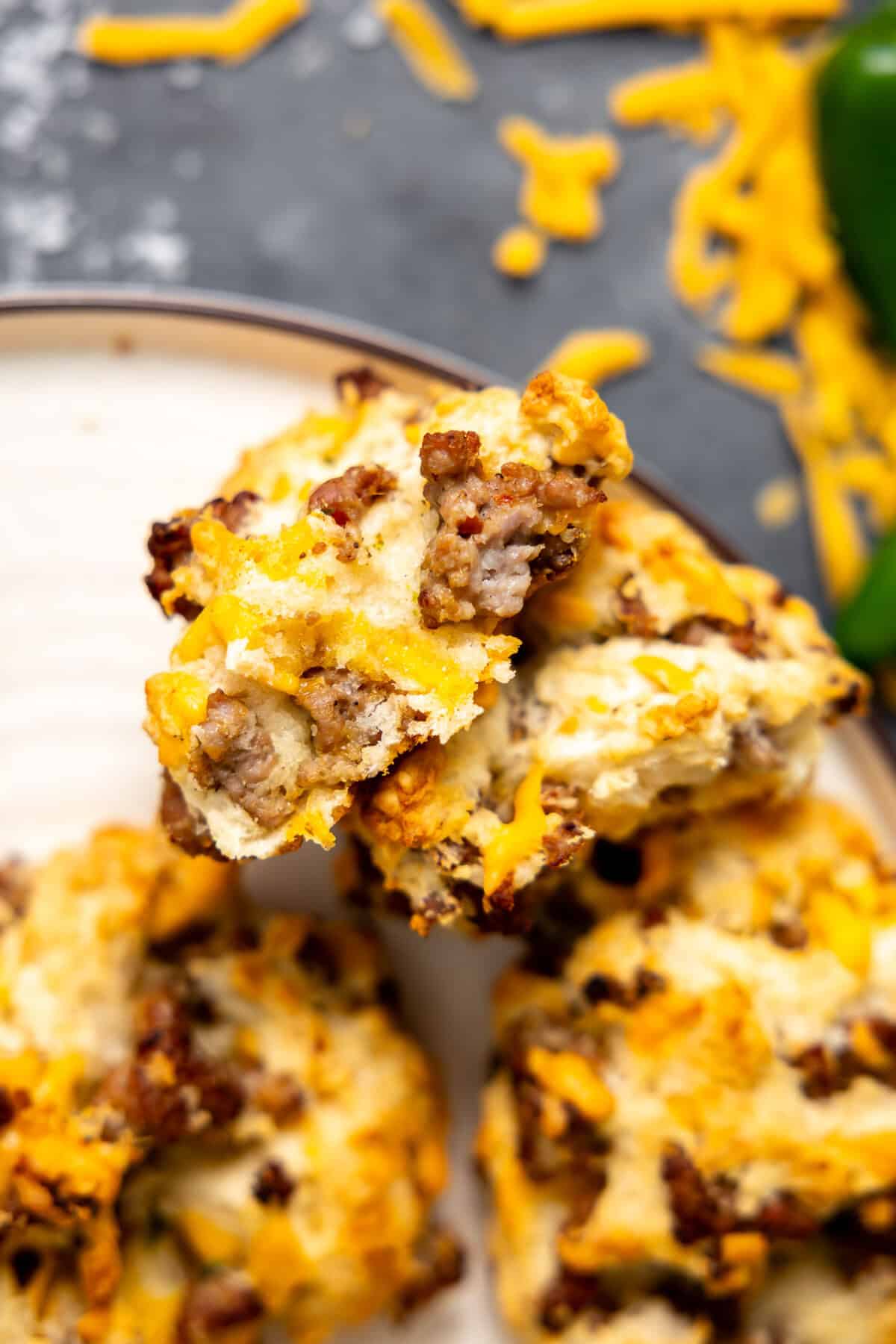 Split apart sausage biscuit on a plate. 