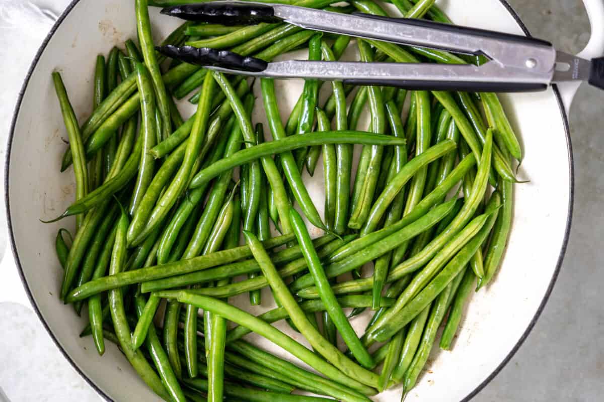 Cooking green beans in a skillet. 