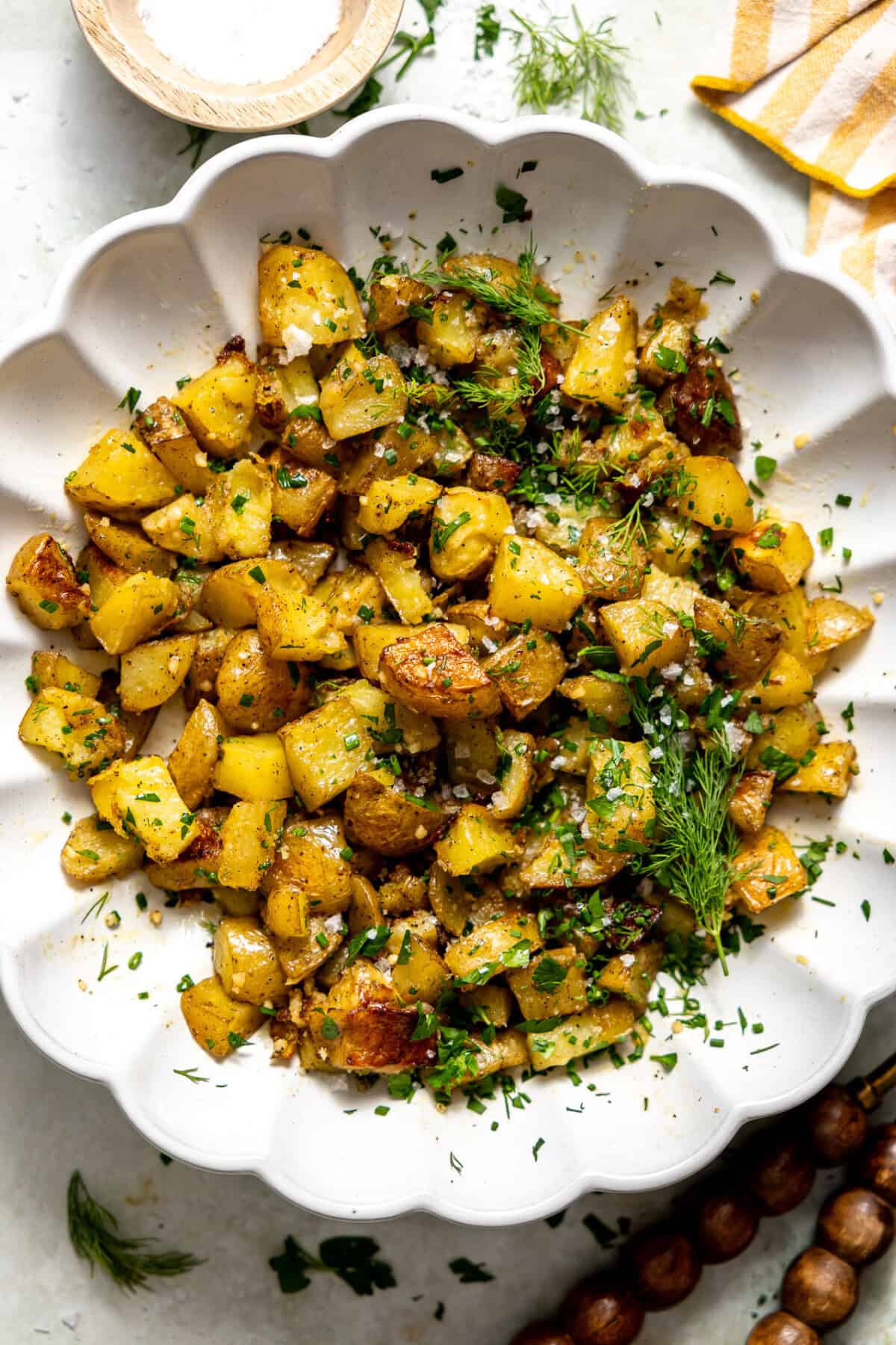 Herb Roasted Potato Salad in a white serving bowl. 