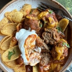 Meatball chili served with sour cream and topped with cilantro. 