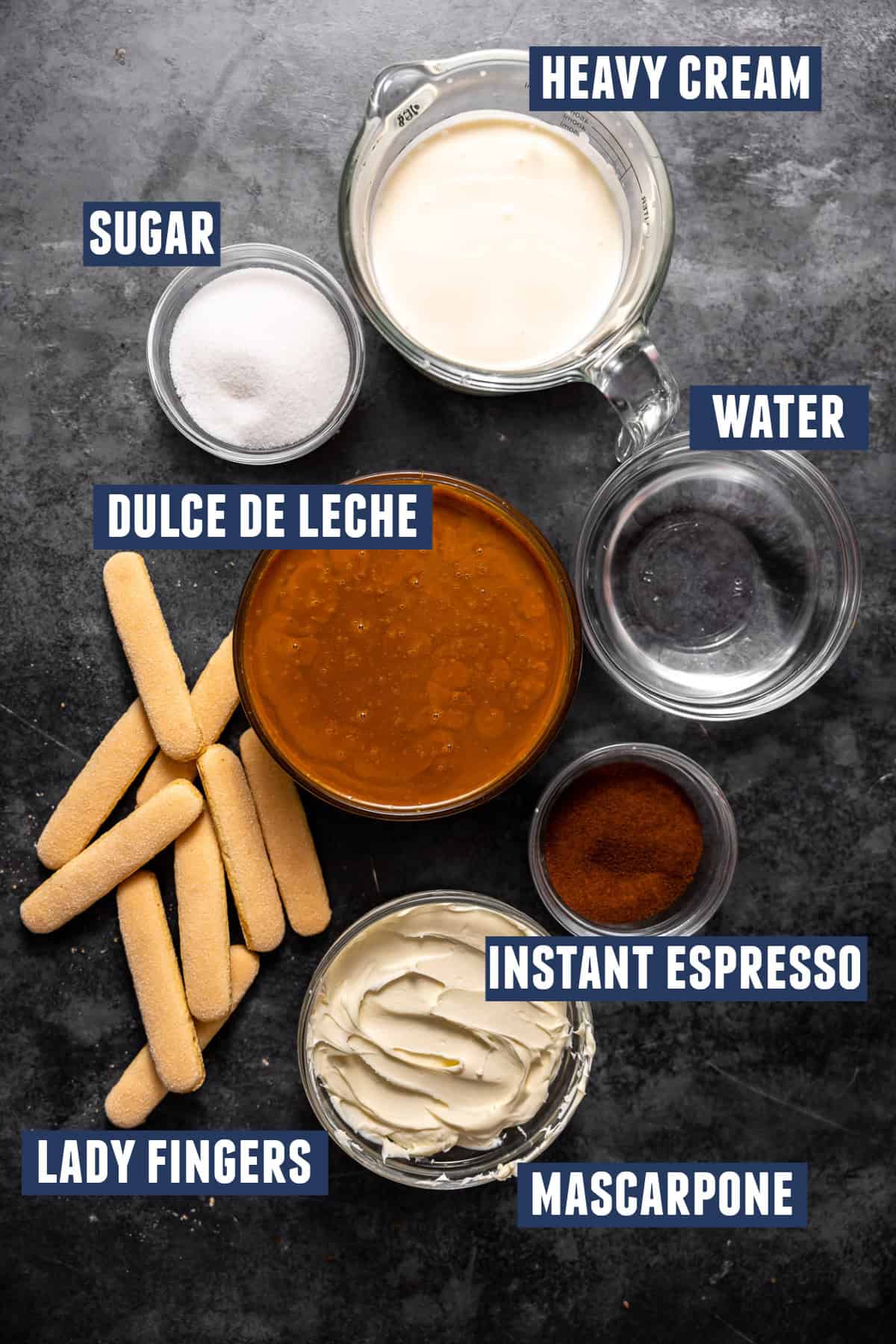 Ingredients needed to make dulce de leche tiramisu laid out on the counter. 