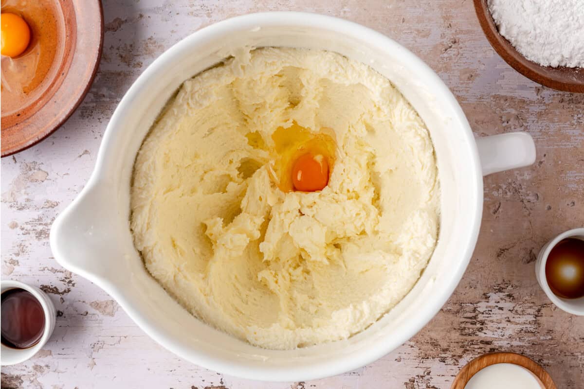 Eggs being added to the creamed butter and sugar. 