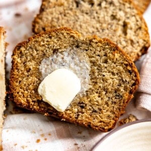 Banana bread served with melted butter on top.