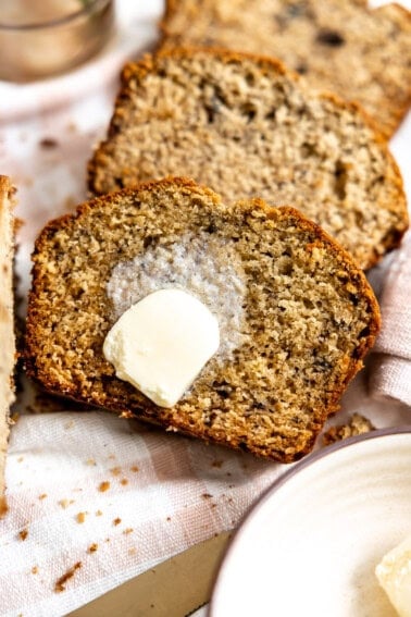 Banana bread served with melted butter on top.