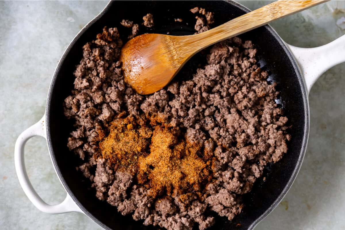 Ground beef cooking in a skillet with a homemade fajita seasoning. 