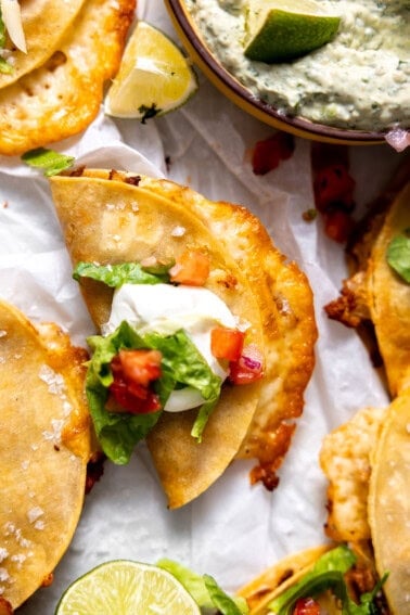 Crispy ground turkey taco topped with sour cream, lettuce, and pico de Gallo.