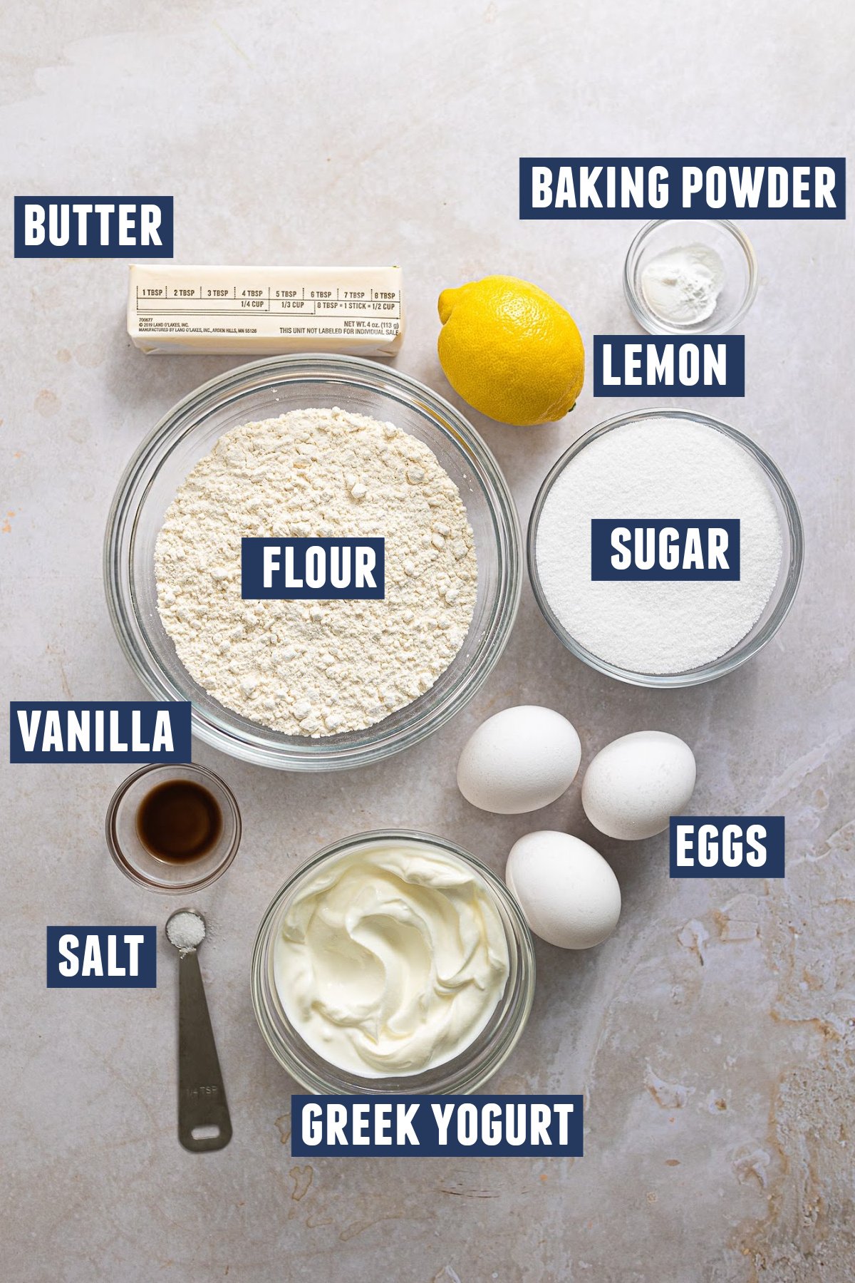 Ingredients needed for lemon loaf cake laid out. 