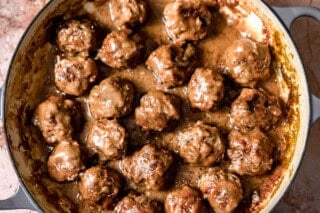 Swedish meatballs in a skillet with creamy gravy.