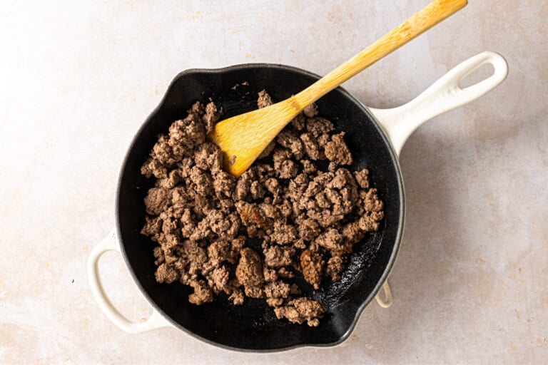 Cooked ground beef in a skillet.