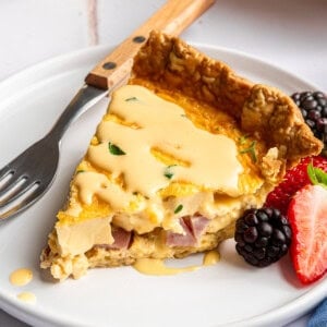 Eggs Benedict quiche topped with homemade hollandaise.
