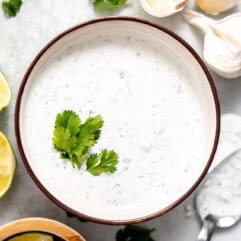 Bowl of cilantro lime sauce topped with fresh cilantro.