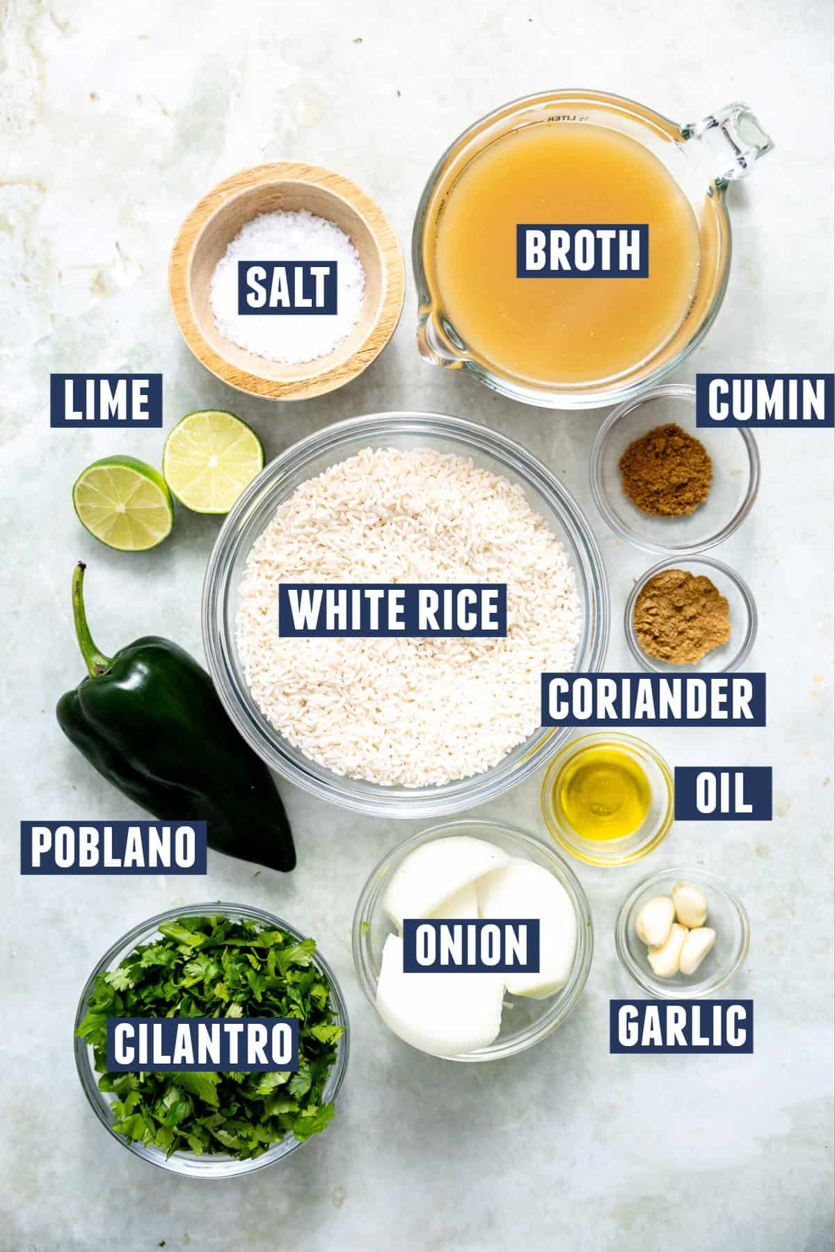Ingredients needed to make Mexican arroz verde or green rice laid out on the counter.