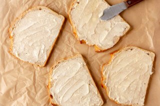 Buttering bread.