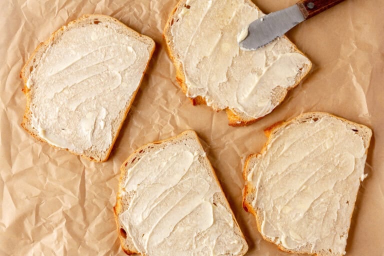 Buttering bread.