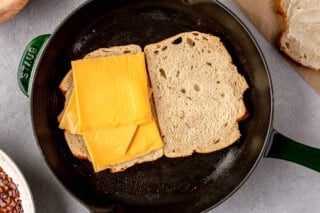 Toasting bread with cheese.