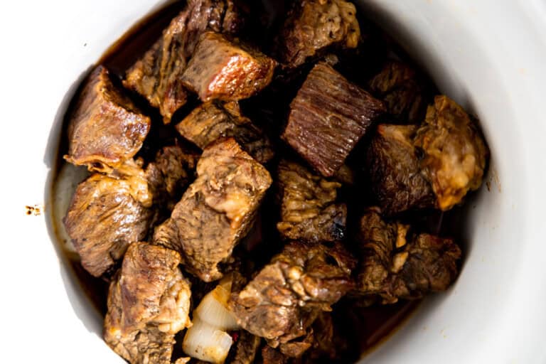 Seared chuck roast in a slow cooker.