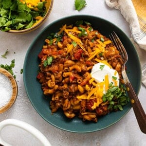 Three bowls of chili Mac on a table