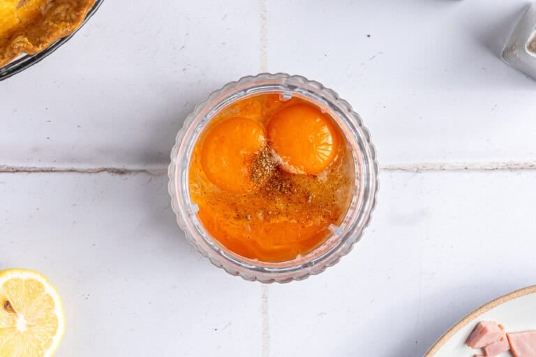 Eggs and seasoning in a blender.