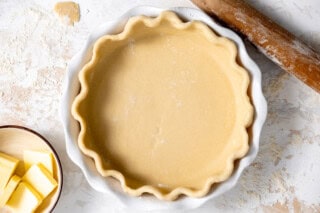 Pie crust in a pie dish.