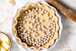 Pie crust with pie weights.