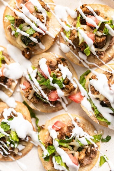 Sheet pan tostadas with a drizzle of crema.