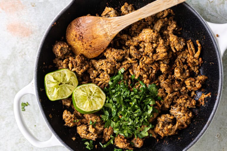 Skillet with cooked cilantro lime ground chicken.