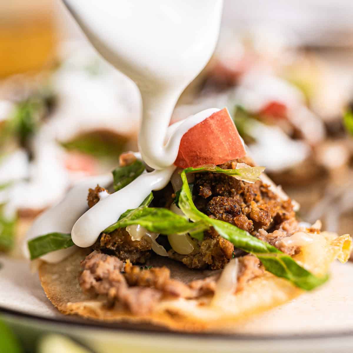 Drizzling crema on tostadas. 
