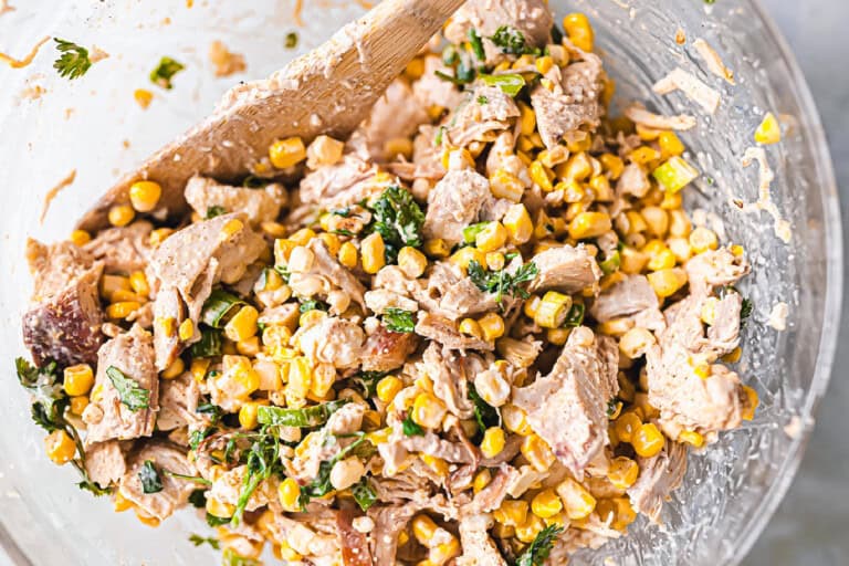 Mexican Street Corn Chicken salad in a glass bowl.