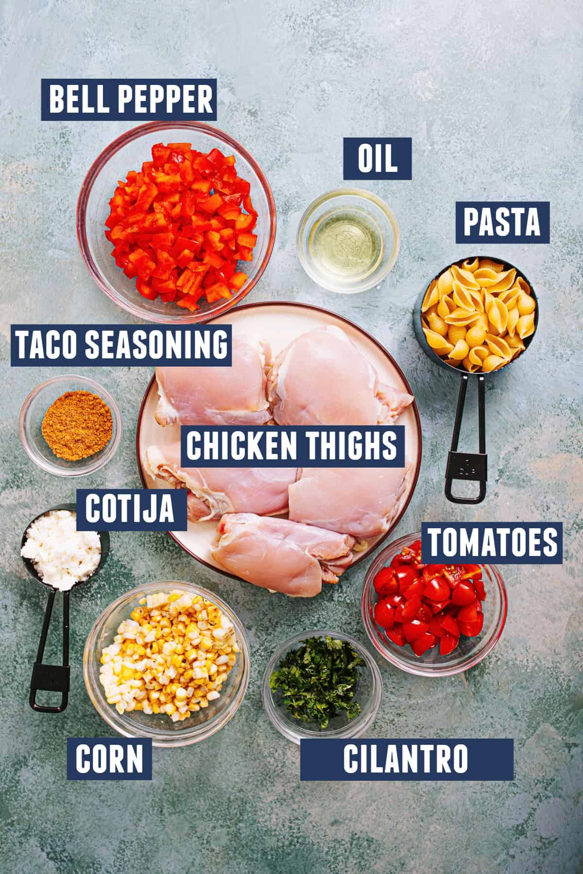 Ingredients needed to make a chicken taco pasta salad. 