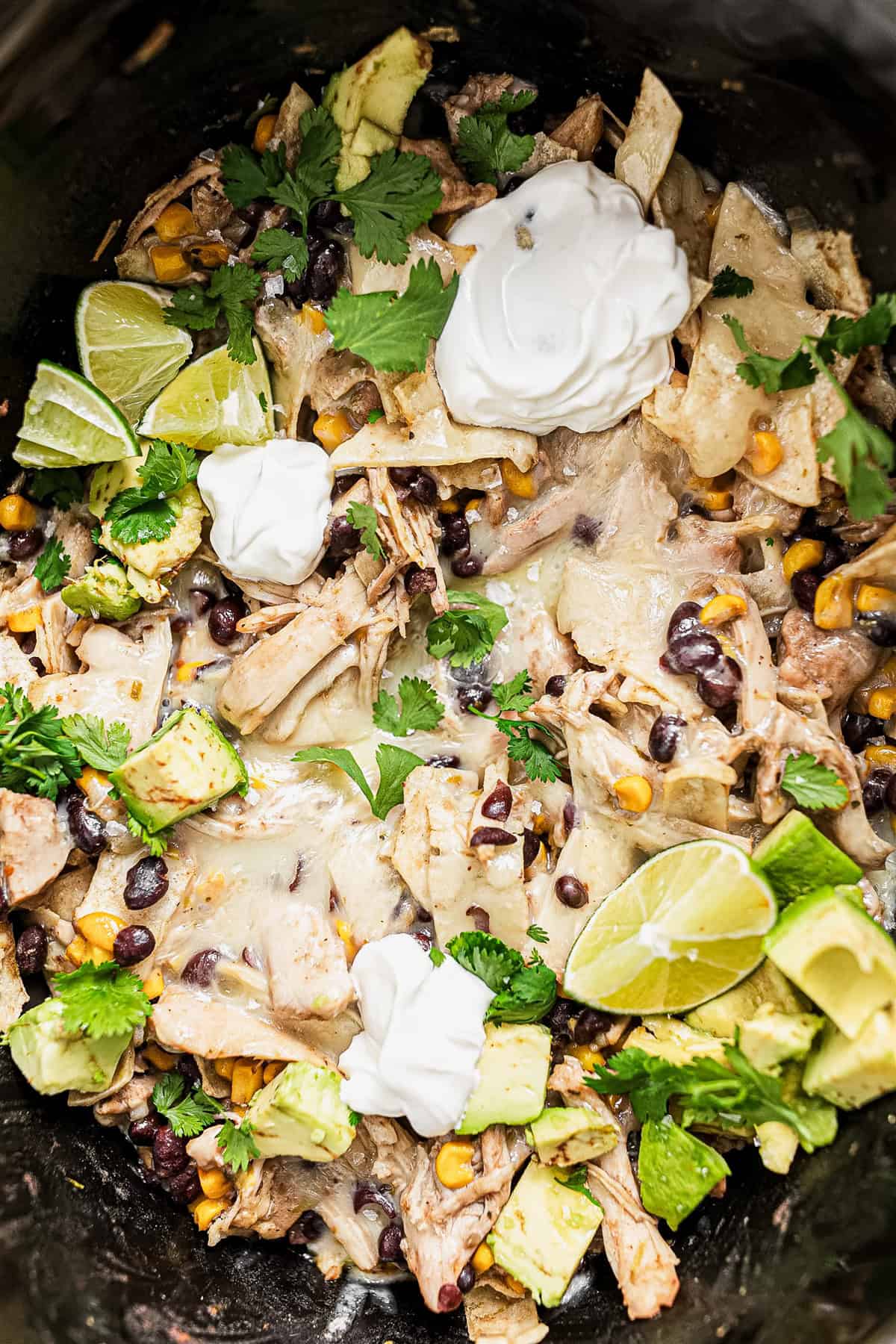 Green Chicken Enchilada Casserole in a slow cooker. 