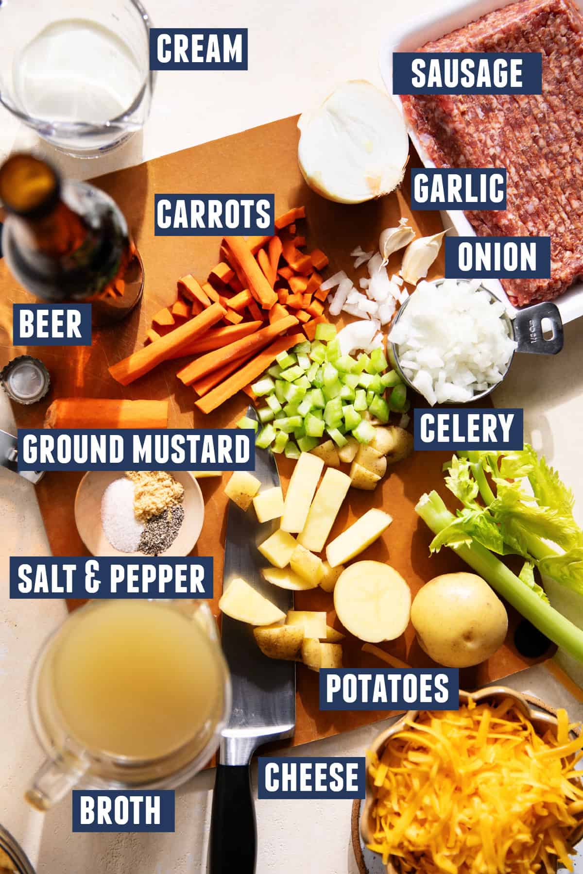 Ingredients needed to make a sausage and potato beer cheese soup. 