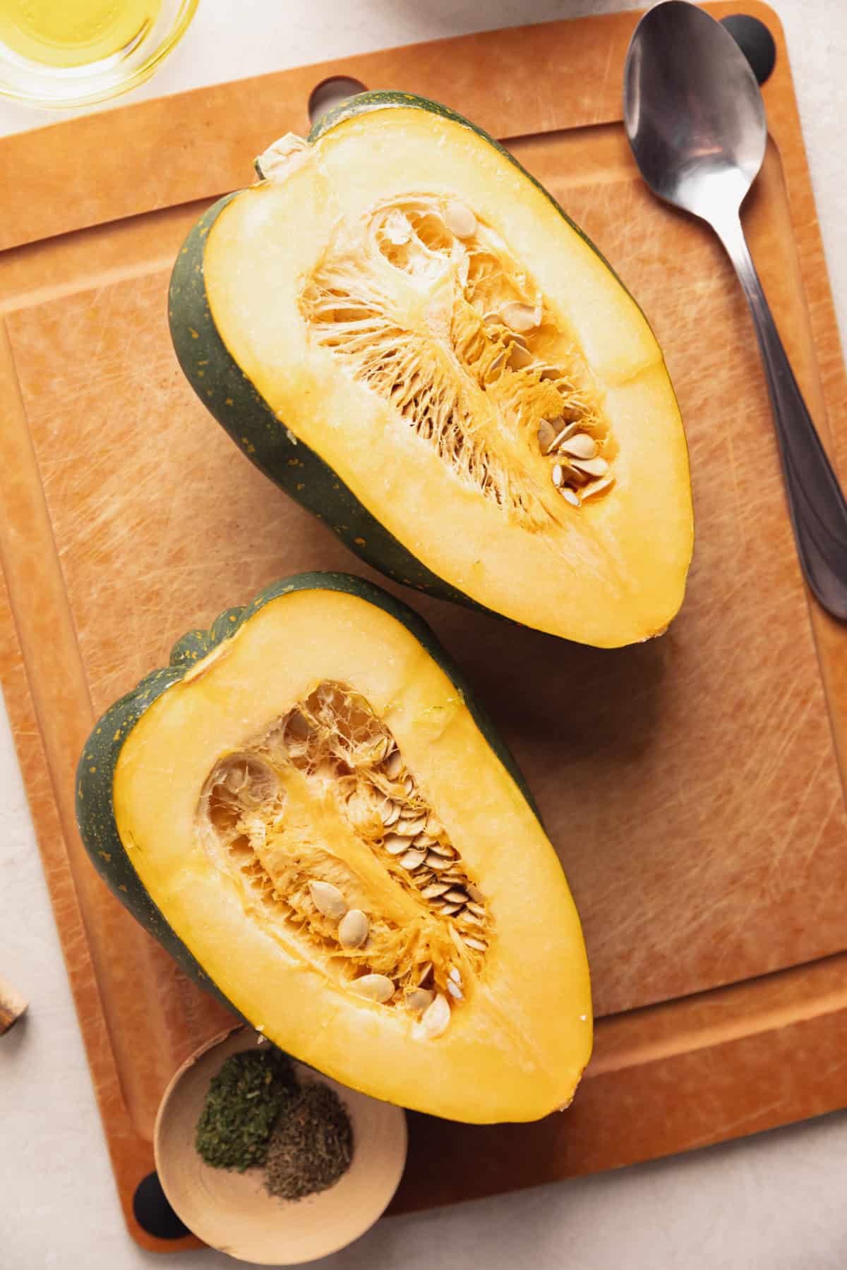 Acorn squash sliced in half.