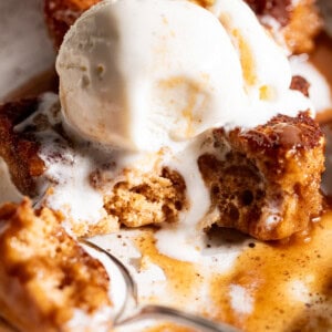 Slice of snickerdoodle cobbler topped with melty vanilla ice cream.