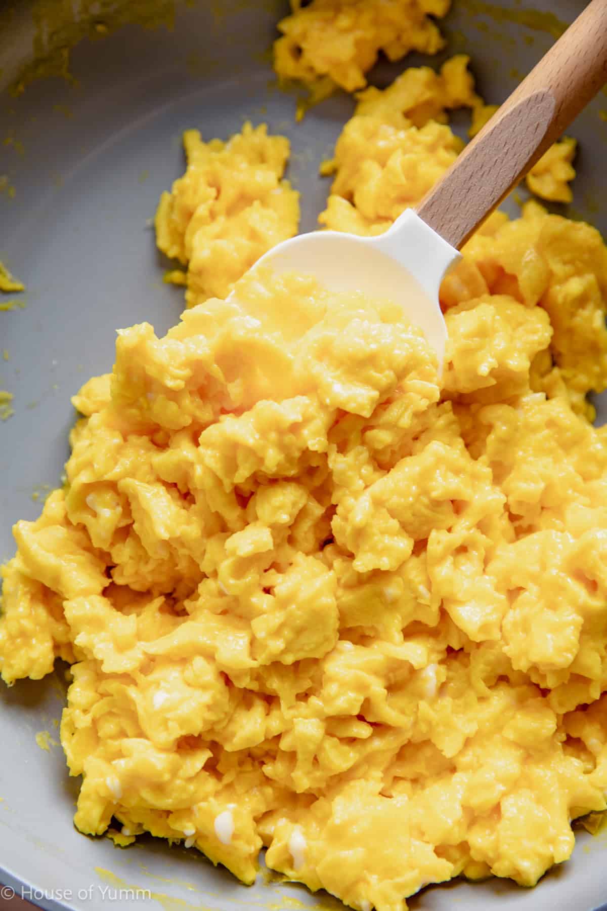Scrambled eggs in a skillet.