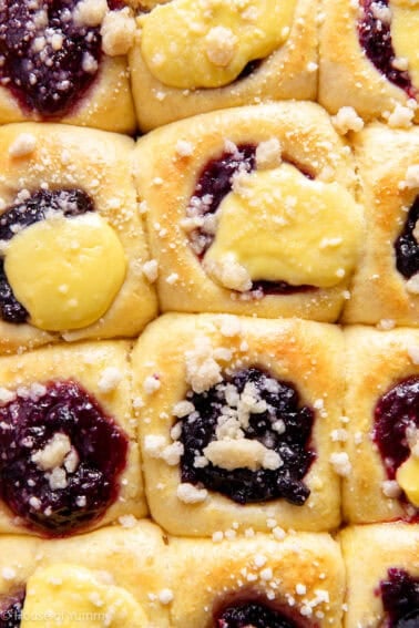 Up close view of berry and cream kolaches in a baking pan.
